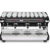 This image is a front view of the Rancilio Classe 9 Xcelsius tall, 3 groups with a taller group area and volumetric dosing controls.